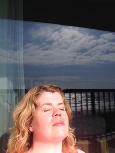 Basking in the sun with the ocean reflection behind me. 